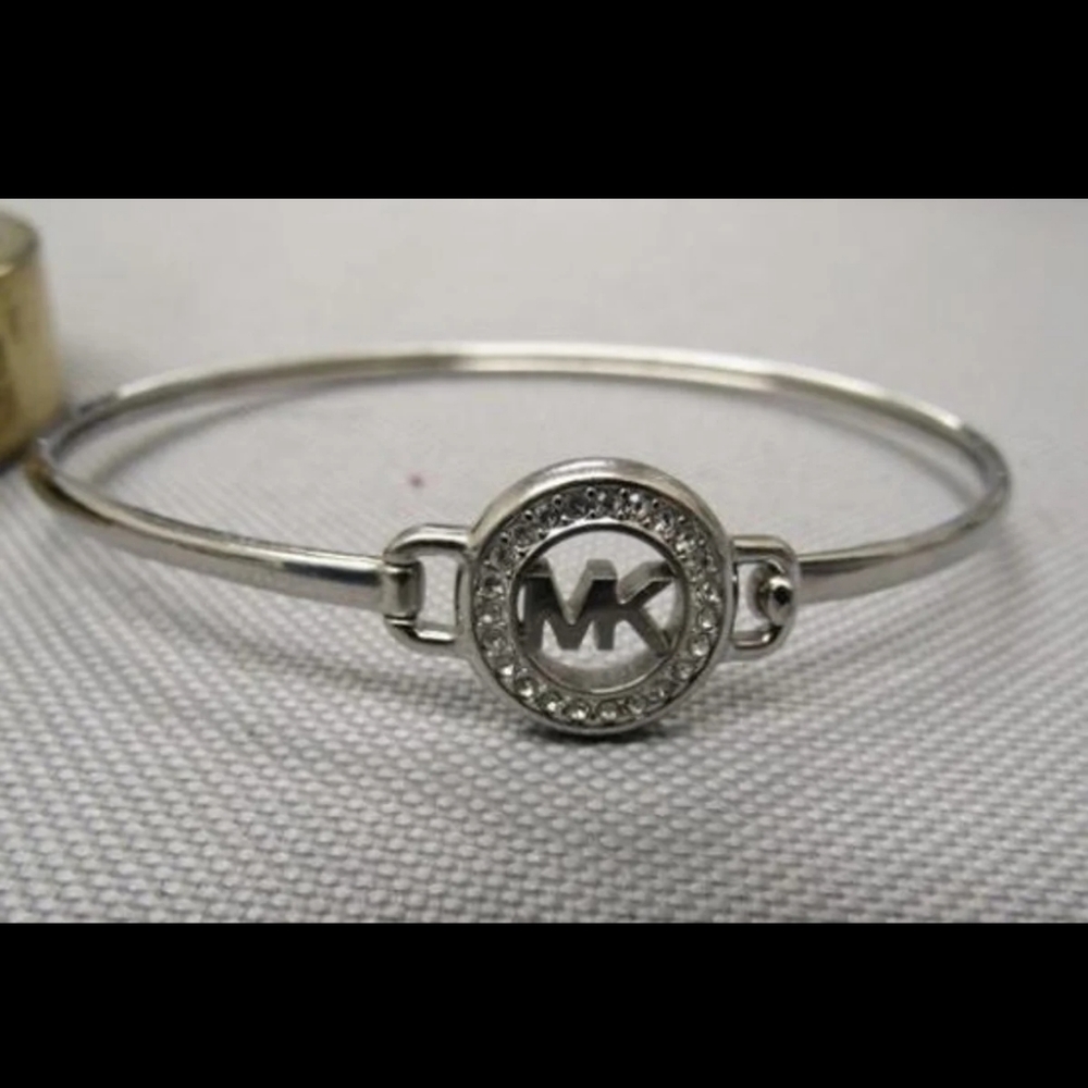 MICHAKIRS PAVE RHINESTONE SIGNATURE LOGO SET IN SILVER